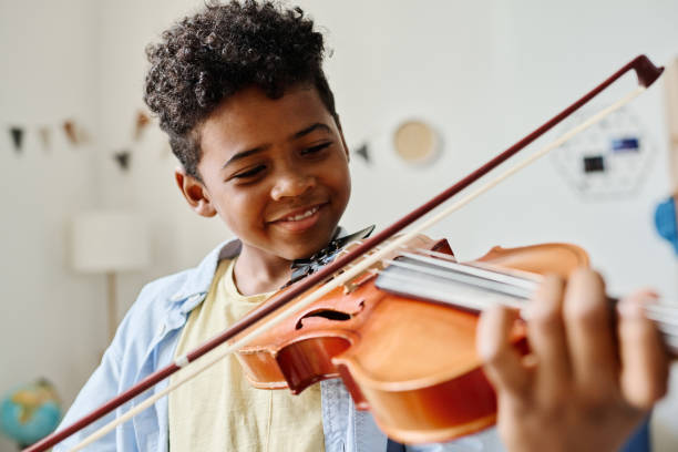 child playing a musical instrument Motivates your child